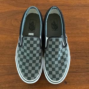 8.5 men 10 women Vans slip on checkerboard shoe in black and pewter check.